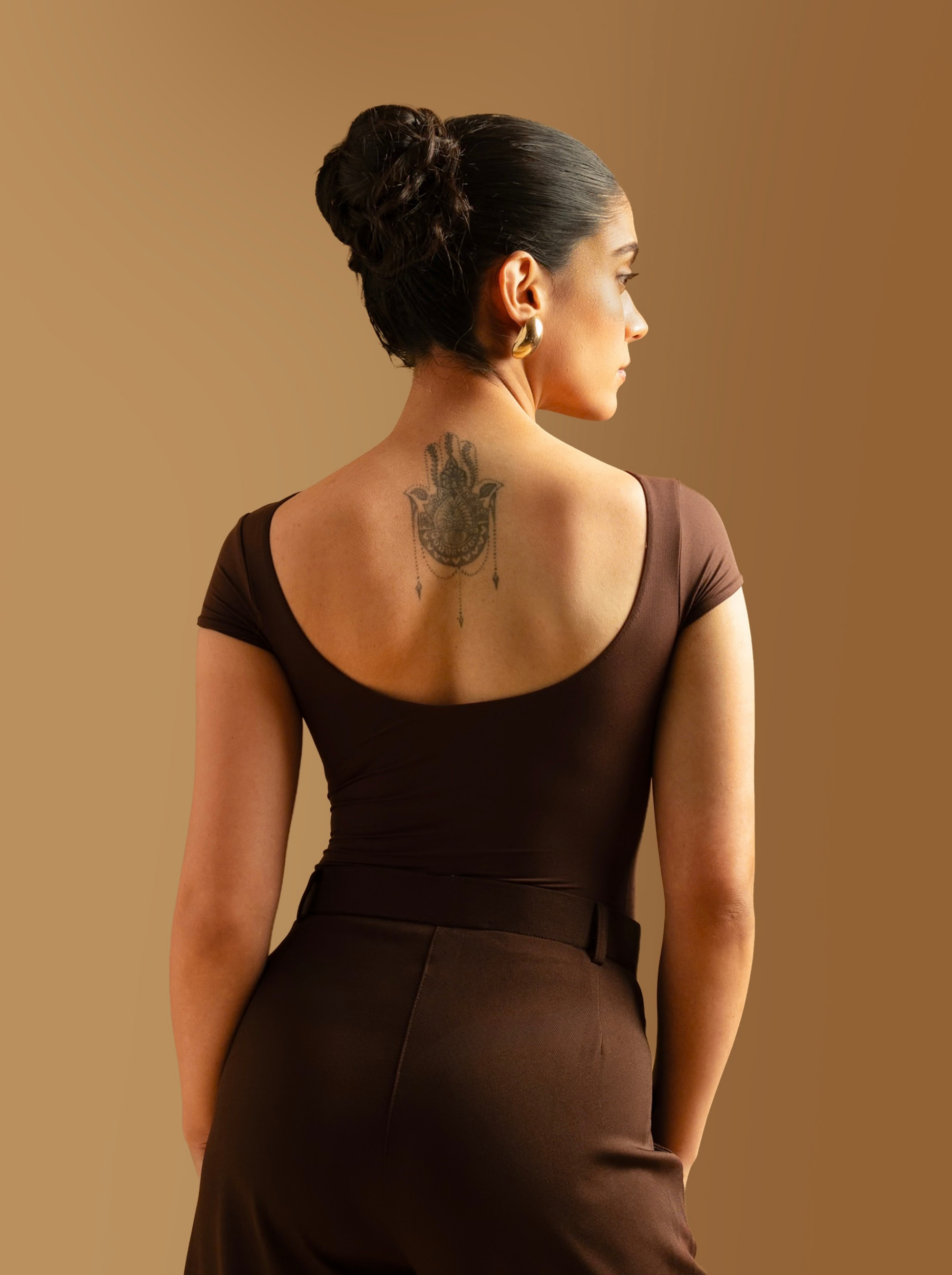 ButterBawd Boat Neck Bodysuit in brown, shown on model, fitted silhouette
