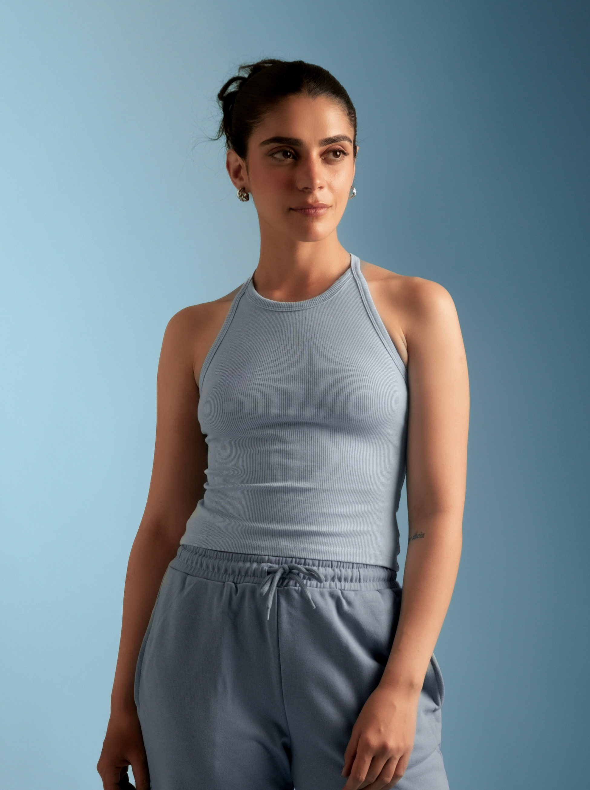 Micro-Rib halter top by ButterBawd, featuring a fitted design and ribbed fabric, shown in a close-up view.