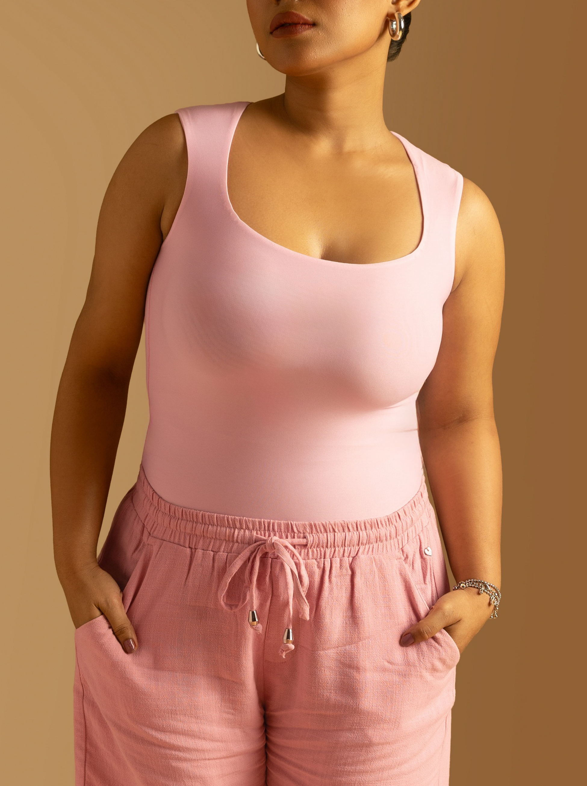 ButterBawd Square Neck Bodysuit in pink, shown on model, fitted long sleeves
