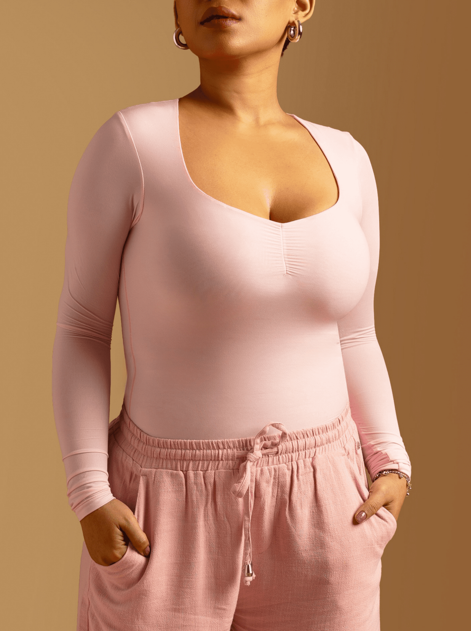 ButterBawd Heartline Melt Top in pink, side view, ruffle neckline detail